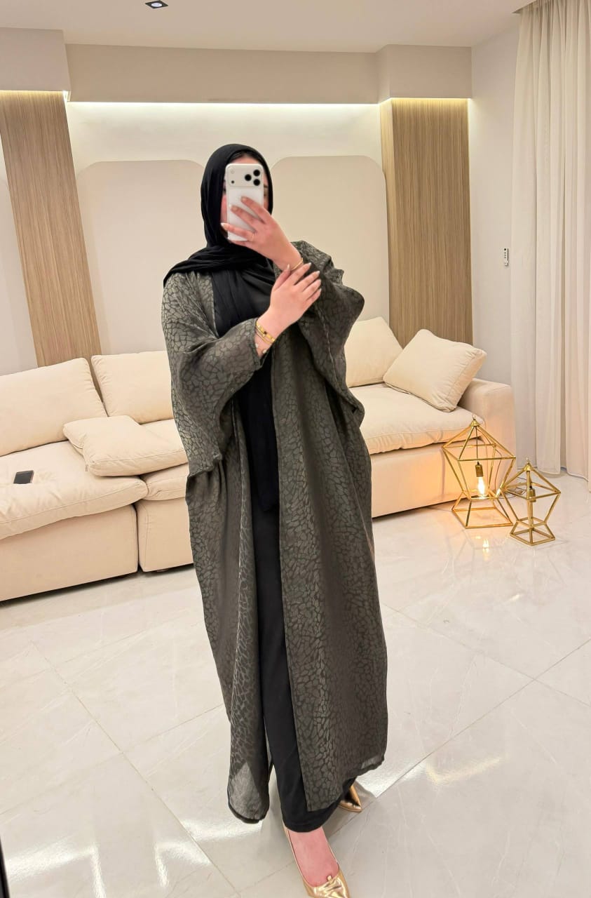 Elegance meets tradition in our Dark green soft silk Kaftan